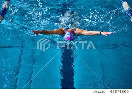 Female athlete swims with a butterfly style.  45871300
