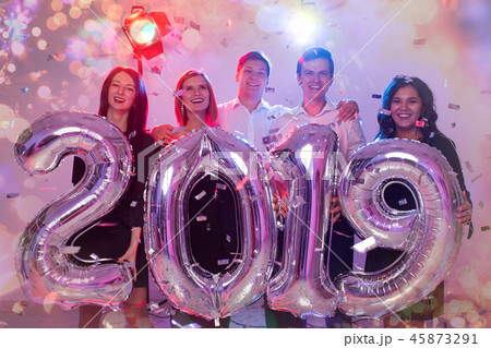 New year 2019 and party concept. Group of cheerful young people friends holding number balloons 45873291