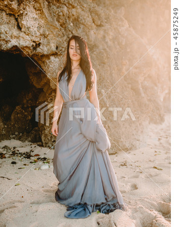 Fashion woman. Brunette woman posing in dress 45875249