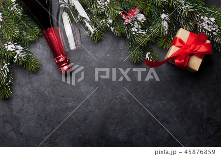 Christmas card with champagne, gift and fir tree 45876859