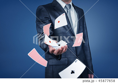 Businessman with flying card deck on blue background 45877658