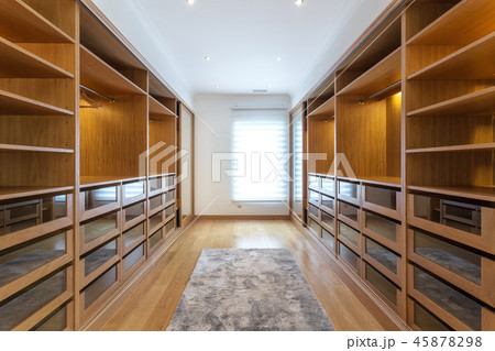 Modern closet in the hotel for different needs and clothes. 45878298