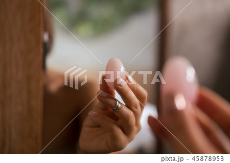 Woman holds yoni egg in hand Woman holds yoni egg in hand 45878953