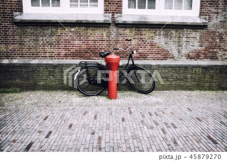 Bicycle near the red fire hydrant in Holland 45879270
