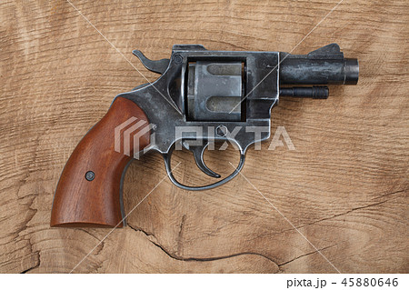 Revolver on the wooden table Revolver on the wooden table 45880646