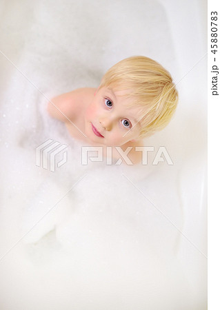 Cute little boy taking a foam bubble bath  45880783
