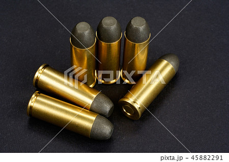 The .45 caliber revolver cartridges on black  45882291