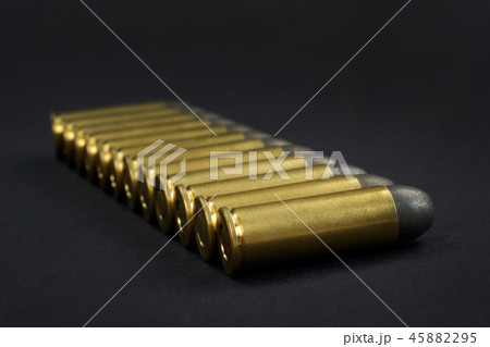 The .45 caliber revolver cartridges on black  45882295