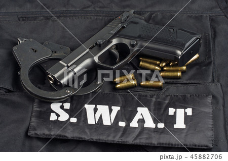 handgun on SWAT black uniform background 45882706