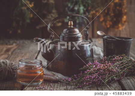 Teapot, healthy tea cup, honey jar, heather bunch 45883439