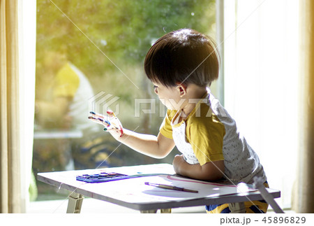 Children is coloring with imagination. 45896829