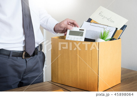 Businessmen are holding resignation document and packing persona 45898064