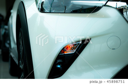 New luxury white car parked in modern showroom 45898751