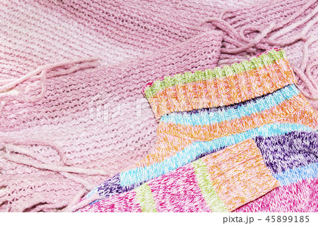 Knitted wool sweaters. Pile of knitted 45899185