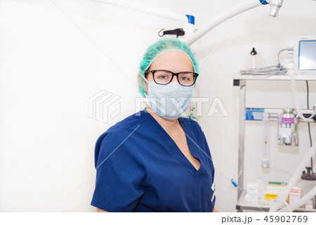 portrait of nurse with mask in surgery room portrait of nurse with mask in surgery room 45902769