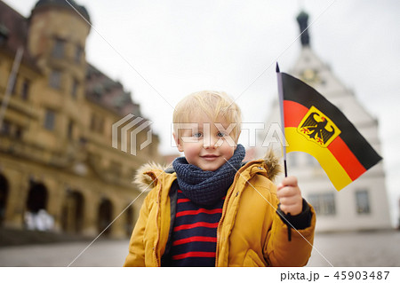 Little boy with a German flag on the square 45903487