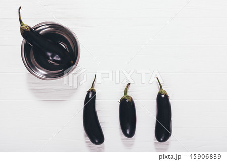 Purple eggplants harvest in metal bowl Purple eggplants harvest in metal bowl 45906839