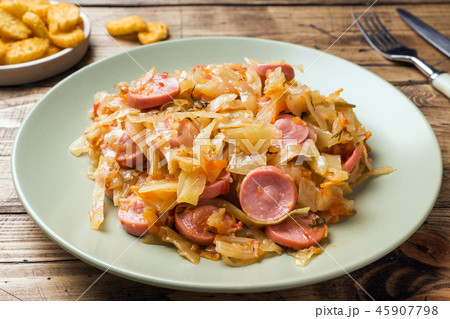 Stewed cabbage with sausages in a plate Stewed cabbage with sausages in a plate 45907798