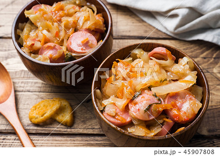 Stewed cabbage with sausages in a plate Stewed cabbage with sausages in a plate 45907808