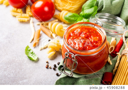Glass jar with homemade classic spicy tomato pasta or pizza sauce. 45908288