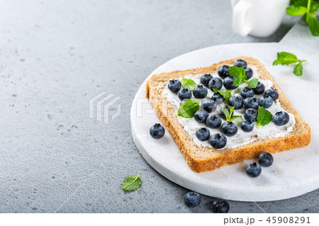 Sandwich with goat cheese and blueberries 45908291