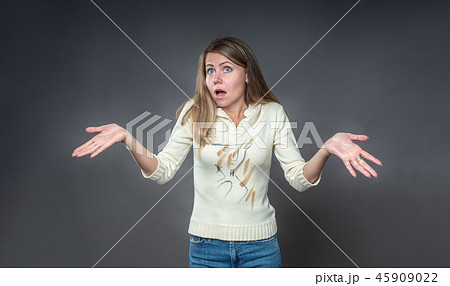 Woman with shocked facial expression. The brunette Woman with shocked facial expression. The brunette 45909022