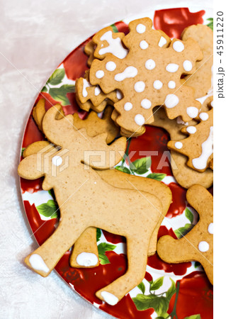 figure ginger Christmas cookies on a red plate 45911220