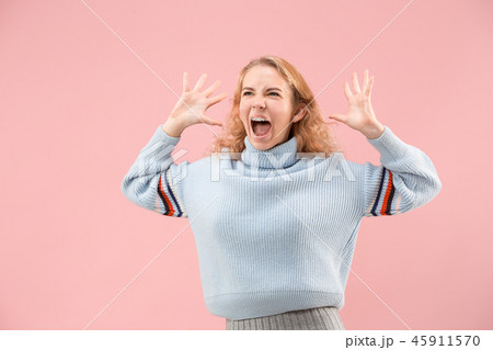 Beautiful woman looking suprised isolated on pink 45911570