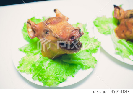Grilled suckling pig on a plate in banquet restaurant. 45911843