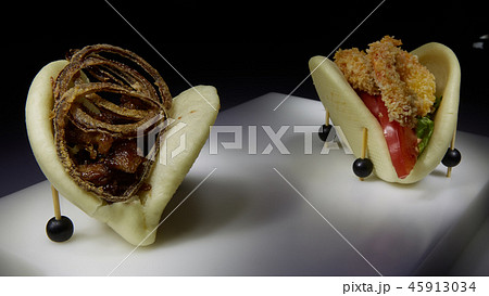 Two spicy taco with shrimp and beef with fried onion 45913034