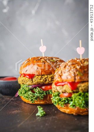 Vegan lentil burgers with kale and tomato sauce Vegan lentil burgers with kale and tomato sauce 45913752