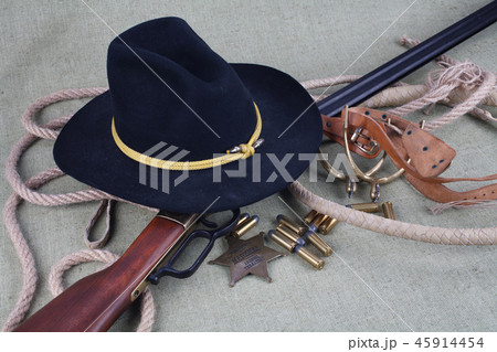 Wild west rifle, ammunition and sheriff badge Wild west rifle, ammunition and sheriff badge 45914454