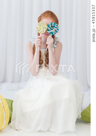 Funny child with candy lollipop 45915337