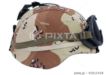 us army helmet with a desert camouflage cover - Stock Photo