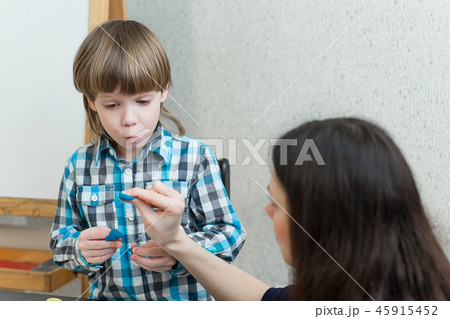 child kid boy and mother play colorful clay 45915452