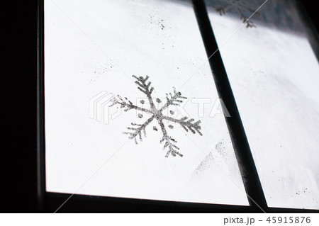 beautiful painted snowflake on the window 45915876
