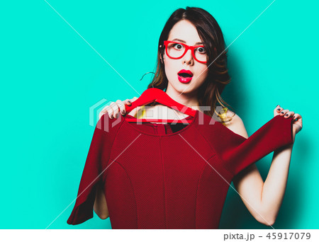 young woman with dress on hanger 45917079