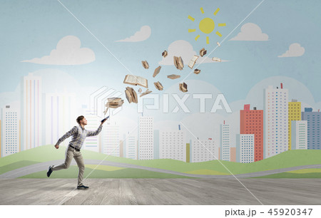 Man running with book 45920347