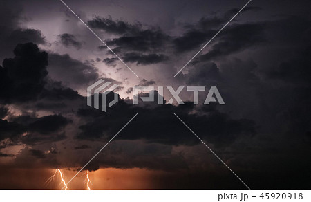Lightning and storm clouds in sky Lightning and storm clouds in sky 45920918