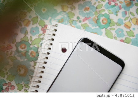 Smart phone on note pad Smart phone on note pad 45921013