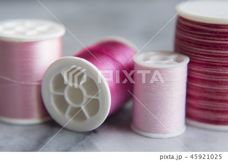 Variety of pink spools of thread Variety of pink spools of thread 45921025