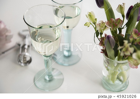 Glasses of white wine and flowers Glasses of white wine and flowers 45921026