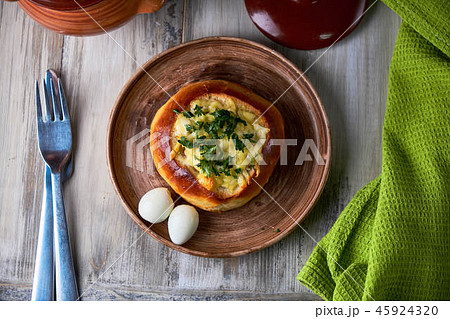 Bread bowls stuffed with mushrooms, chicken meat, cheese and bolognese sauce for lunch. Julienne in 45924320