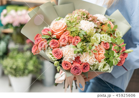 European floral shop. Bouquet of beautiful Mixed flowers in woman hand. Excellent garden flowers in 45925606