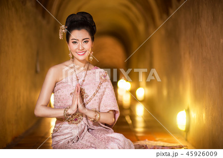 Beautiful Thai girl in Thai traditional costume Beautiful Thai girl in Thai traditional costume 45926009