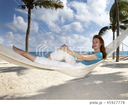 beautiful young woman in a hammock on the beach on beautiful young woman in a hammock on the beach on 45927778