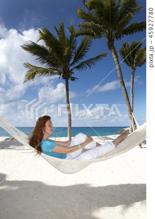 beautiful young woman in a hammock on the beach on beautiful young woman in a hammock on the beach on 45927780
