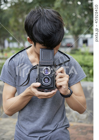 Teenager with camera Teenager with camera 45928410