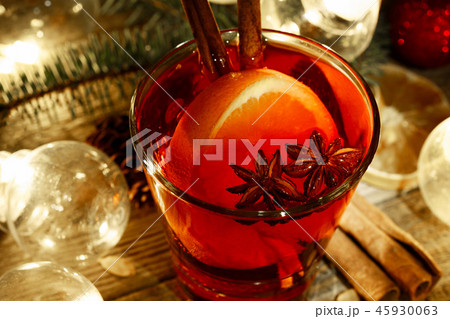 Mulled wine in a glass on a wooden background Mulled wine in a glass on a wooden background 45930063