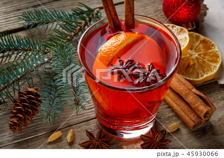 Mulled wine in a glass on a wooden background Mulled wine in a glass on a wooden background 45930066